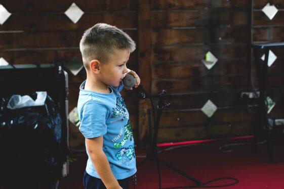 little boy with a mic