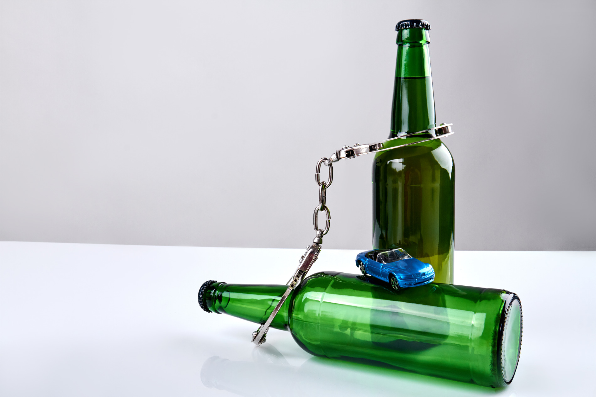 beer bottles and handcuffs